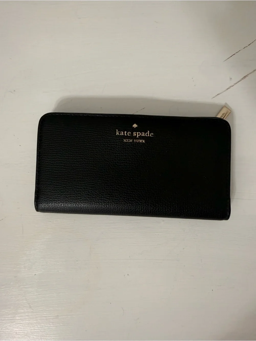 kate spade black leather zip-around continental wallet with gold logo